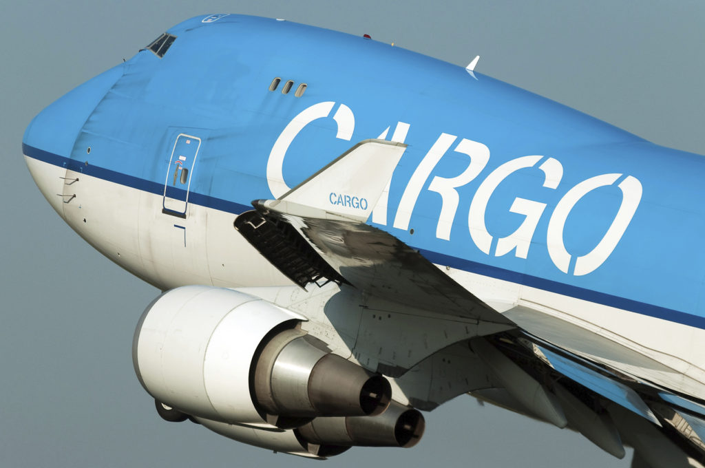 blue colored cargo plane taking off